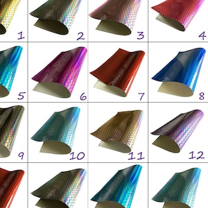 May include: Twelve samples of iridescent faux leather with a scale pattern. The samples are numbered 1 through 12, and some numbers appear twice.