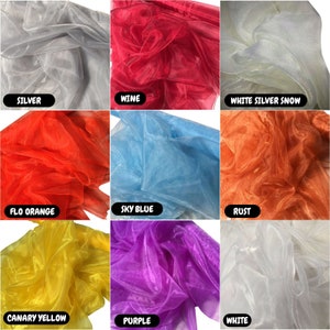 May include: Nine swatches of sheer fabric in various colors, including silver, wine, white silver snow, flo orange, sky blue, rust, canary yellow, purple, and white. The fabric is translucent and has a delicate texture.