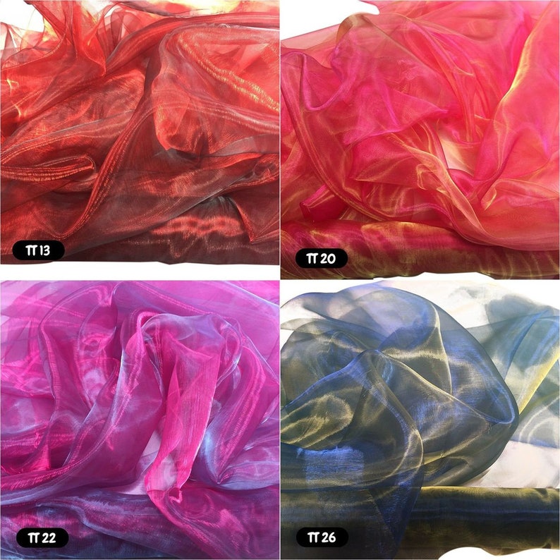 May include: Four swatches of iridescent sheer fabric in red, pink, blue, and black. The fabric is translucent and has a shimmery finish. The swatches are labelled with the numbers TT 13, TT 20, TT 22, and TT 26.