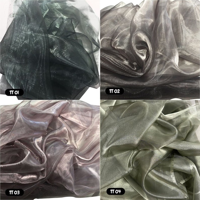 May include: Four swatches of sheer iridescent fabric in different colours: black, silver, pink, and green. The fabric is translucent and has a shimmery finish.