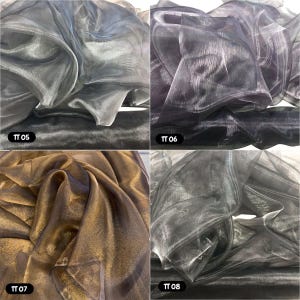 May include: Four swatches of sheer fabric in different colours: silver, black, gold, and grey. The swatches are labelled with the numbers TT 05, TT 06, TT 07, and TT 08.