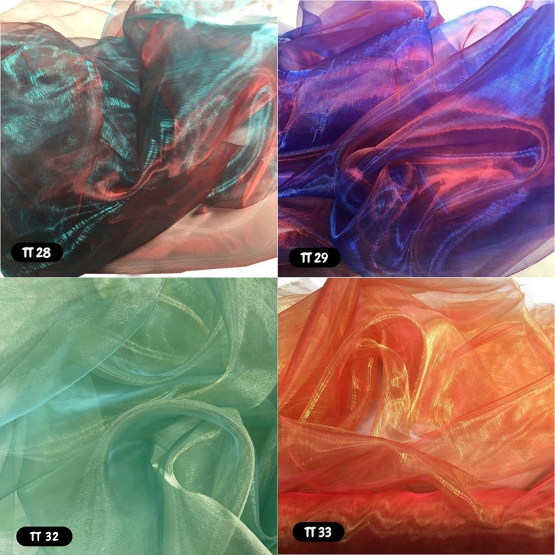 May include: Four swatches of iridescent sheer fabric in different colours: teal and red, purple and red, green and gold, and orange and gold. The swatches are labelled with the numbers TT 28, TT 29, TT 32, and TT 33.