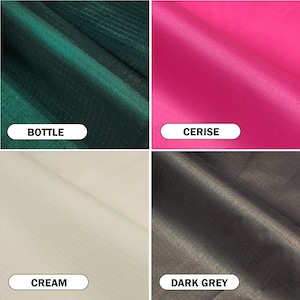 May include: A collage of four fabric swatches in different colors. The top left swatch is a dark green with the word "BOTTLE" below it. The top right swatch is cerise pink with the word "CERISE" below it. The bottom left swatch is cream with the word "CREAM" below it. The bottom right swatch is dark grey with the word "DARK GREY" below it.