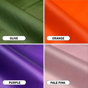 May include: A collage of four fabric swatches in olive green, orange, purple, and pale pink. Each swatch has a label with its color name. The olive green and orange fabrics have a grid-like texture, while the purple and pale pink fabrics are smooth.