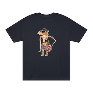 May include: A navy blue t-shirt with a graphic print of a traditional Indonesian shadow puppet. The puppet is depicted in a standing pose with intricate details and colorful clothing.