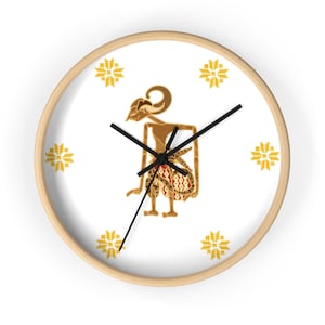May include: A white clock with a wooden frame features a brown and gold puppet figure in the center. The puppet is surrounded by six yellow stylized flower designs.