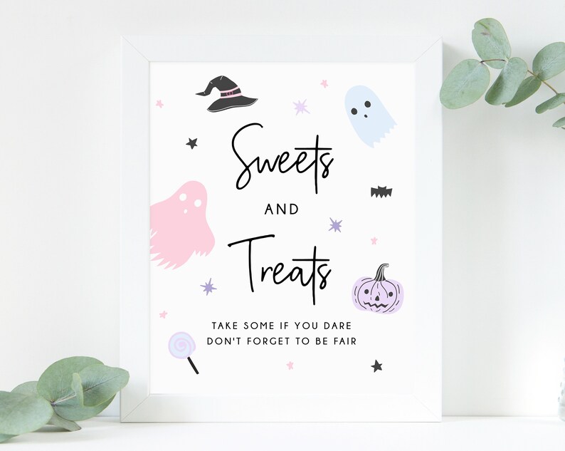 May include: A framed white sign with the words "Sweets and Treats" in black script, decorated with cartoon ghosts, a witch's hat, a pumpkin, and stars. The sign includes the text "Take some if you dare, don't forget to be fair."