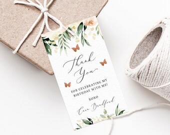 May include: A white thank you tag with a floral design and butterflies. The text reads "Thank You" and "For celebrating my birthday with me! XOXO Cara Bradford".