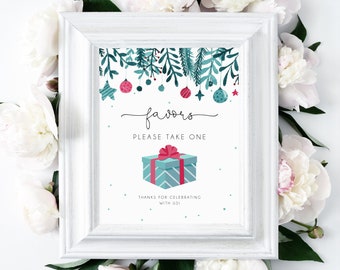 May include: A white frame with a white mat surrounding a printable sign with a Christmas theme. The sign has a teal and pink gift box with a red bow, green and blue branches with ornaments, and the text "favors please take one thanks for celebrating with us".