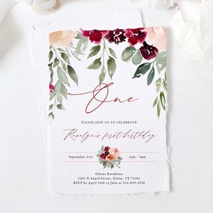 May include: A watercolor-style invitation with floral accents. The design features burgundy and peach flowers with green foliage. The word "One" is written in a cursive font, and the text "Roselyn's first birthday" is also included.