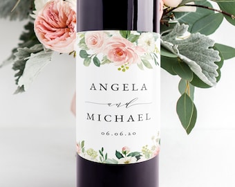 Puede incluir: Una etiqueta de botella de vino blanco con un diseño floral en tonos rosas y verdes. La etiqueta dice "Angela y Michael 06.06.20".