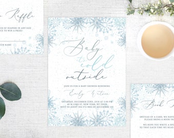 Peut inclure: Une invitation à une fête prénatale avec un motif de flocons de neige bleus et blancs. Le texte indique "Baby it's cold outside" et comprend la date, l'heure et le lieu de l'événement. L'invitation demande également aux invités d'apporter un livre au lieu d'une carte.