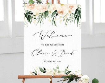 May include: A wedding welcome sign with a floral border. The sign reads "Welcome to the wedding of Claire & Brad October 22, 2022".