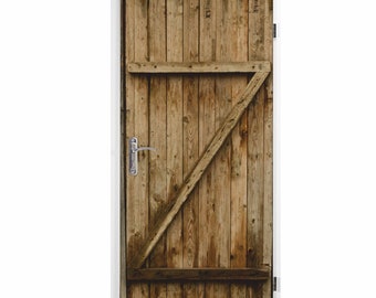 May include: A rustic wooden door with a diagonal brace and a silver door handle. The door is made of weathered wood planks.