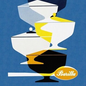 May include: A stack of four white, blue, yellow, and black ceramic bowls with a yellow label that says "Barilla" and the text "la pasta del buon appetito".