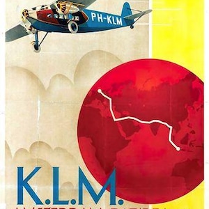 May include: A vintage KLM travel poster showing a blue and red aeroplane with "PH-KLM" on its side, set against a cloudy sky and a red globe. The poster also features the text "K.L.M. AMSTERDAM-BATAVIA V.V. HOLLAND-JAVA WEEKLY MAIL-PASSENGERS-FREIGHT."
