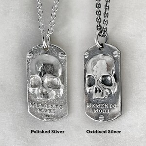 two dog tags showing the different finishes, polished silver or oxidised silver by jewel thief brighton