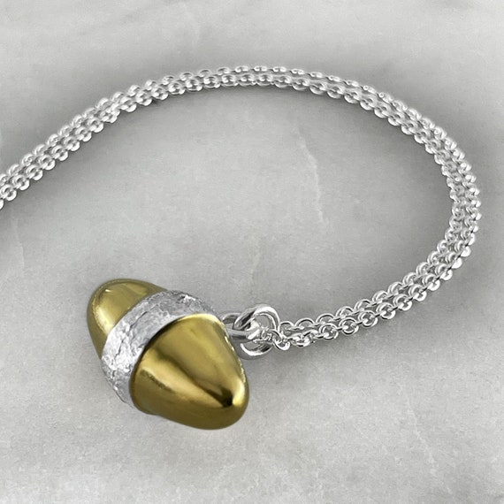 Gold egg pendant deals