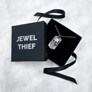 silver dog tag in a jewel thief brighton gift box