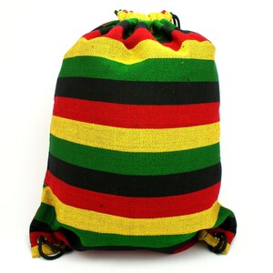 May include: A drawstring bag with red, yellow, and green horizontal stripes. The bag is made of a woven fabric.