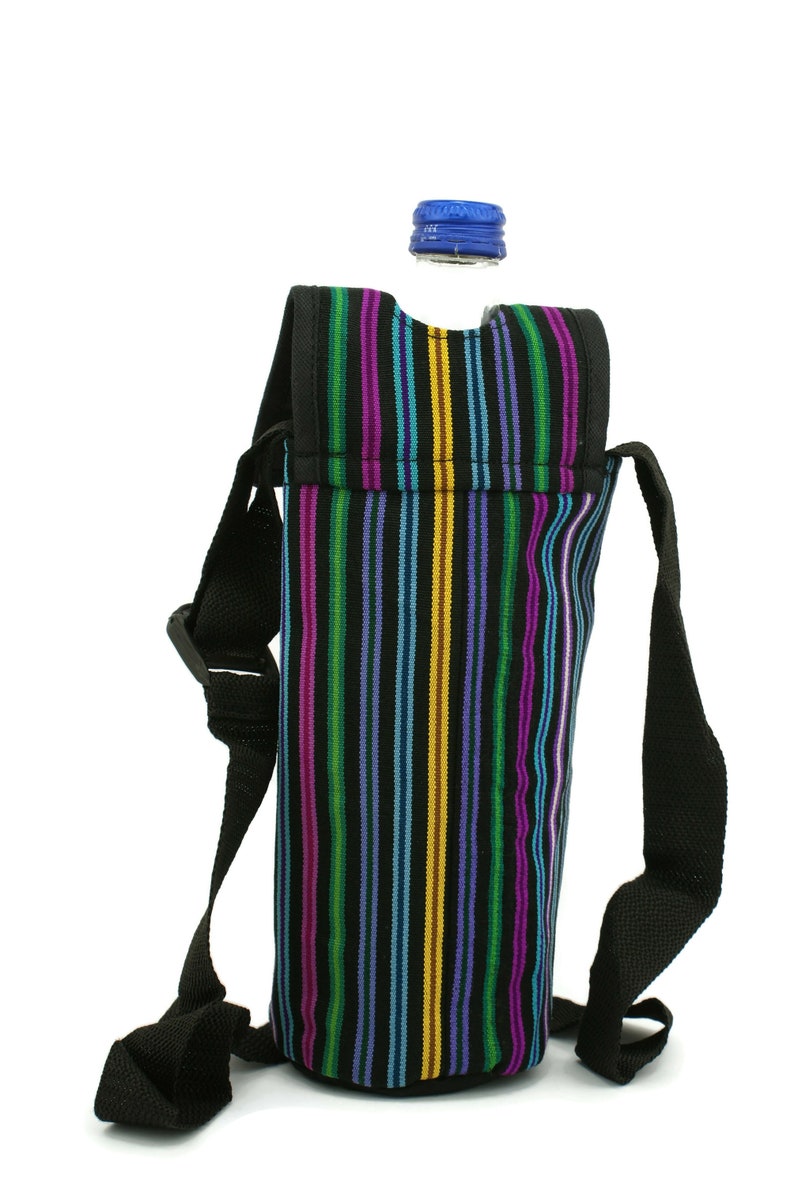 May include: A black and colorful striped fabric water bottle holder with a black adjustable strap. The holder is designed to fit a standard-sized water bottle.