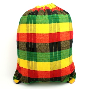 May include: A drawstring bag made of fabric with a plaid pattern in red, yellow, green, and black.