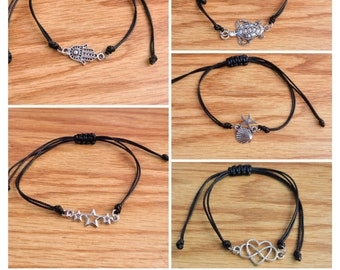 Adjustable cord charm bracelet