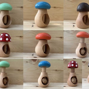 May include: Ten wooden nutcrackers shaped like mushrooms with different coloured tops. The nutcrackers are numbered 1 through 10.
