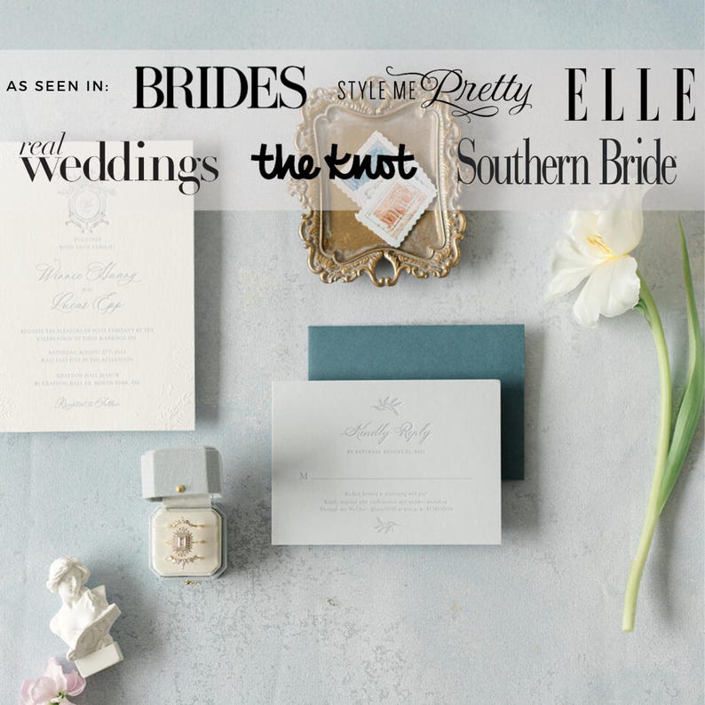 May include: A collection of wedding stationery, including an invitation, reply card, and envelope in pastel shades. A ring box and a small sculpture are also visible. The image includes text from wedding publications.