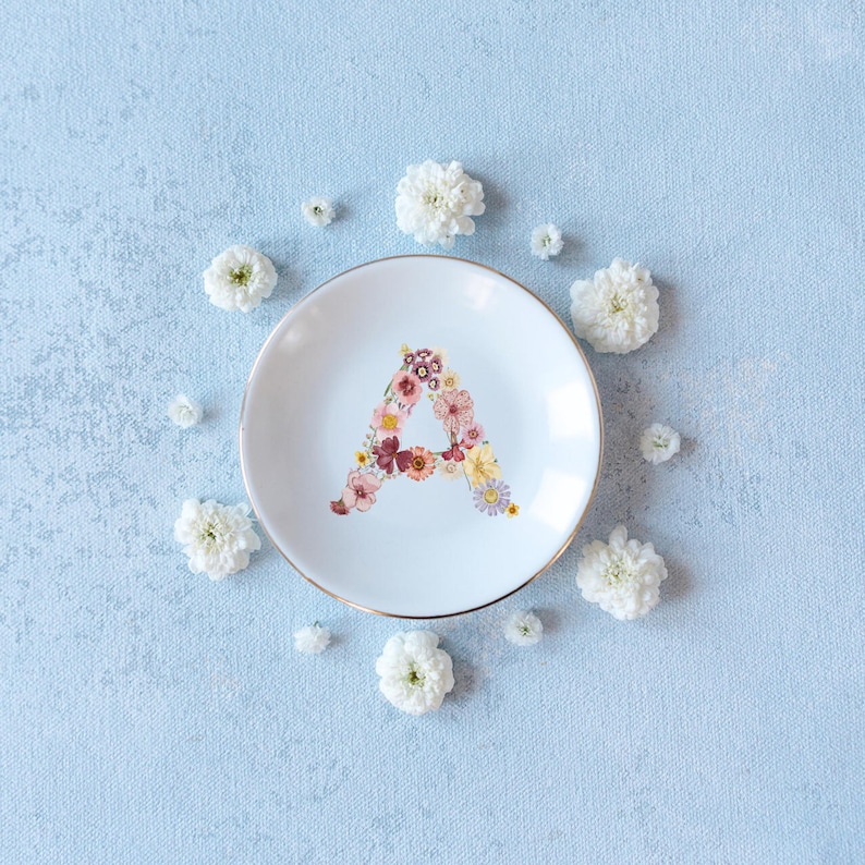 3 inch round ceramic ring dish with gold trim and personalized floral initial, wildflower jewelry dish for bride or bridesmaid gift custom floral initial ring dish with wildflower design, personalized trinket dish for wedding ring holder