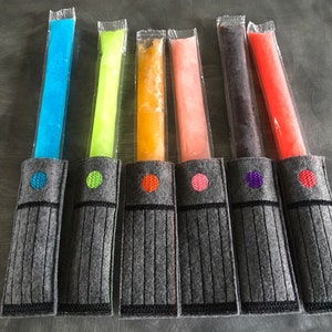 Fantastic light wand freezer popsicle holder! You choose the colors. Great galaxy party favor! Perfect for your Jedi! Quantity pricing!