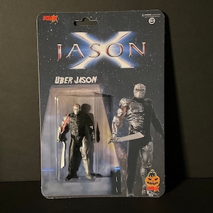 May include: A Jason X Uber Jason action figure in a clear plastic package. The figure is black and silver with a red arm and a silver blade. The packaging has the words "JASON X" and "UBER JASON" printed on it, with a starry background.