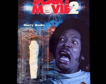 May include: A Scary Movie 2 action figure featuring Shorty Meeks. The packaging includes the movie title in red and white, and a close-up of Shorty's face. The figure is a white, rolled item.