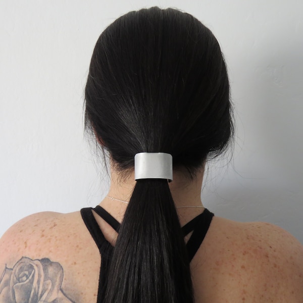 VIDEO-Brushed metal Hair Cuff slides onto your ponytail holder in 7 seconds. Cover that naked tail! Carry it with you. Look professional.