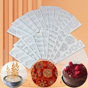 May include: A set of 20 silicone cake decorating stencils featuring various floral, geometric, and leaf designs. The stencils are white and are arranged in a fan shape. The image also shows a cake decorated with a similar design and a small potted plant with similar designs.