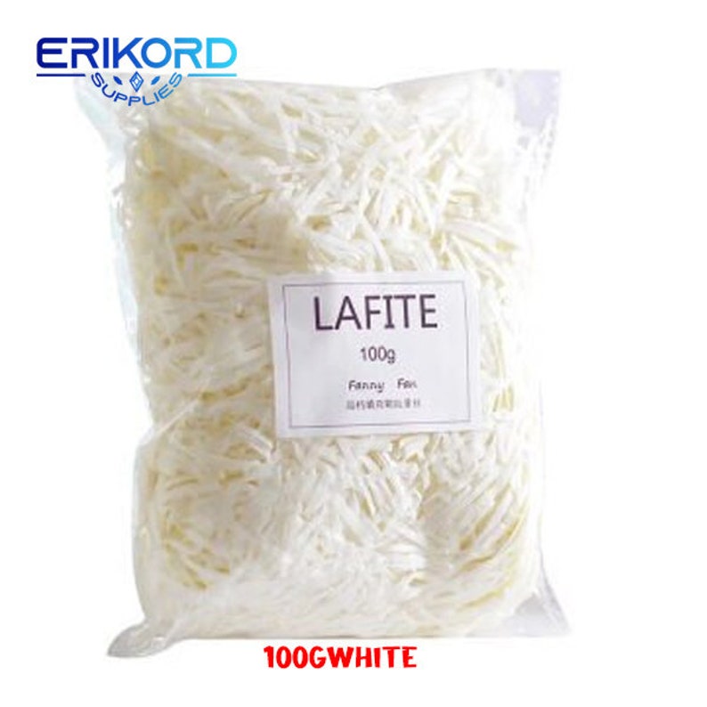 May include: A white plastic bag filled with white shredded paper. The bag has a label that says "LAFITE 100g Fanny Fox". The bottom of the bag says "100G WHITE".