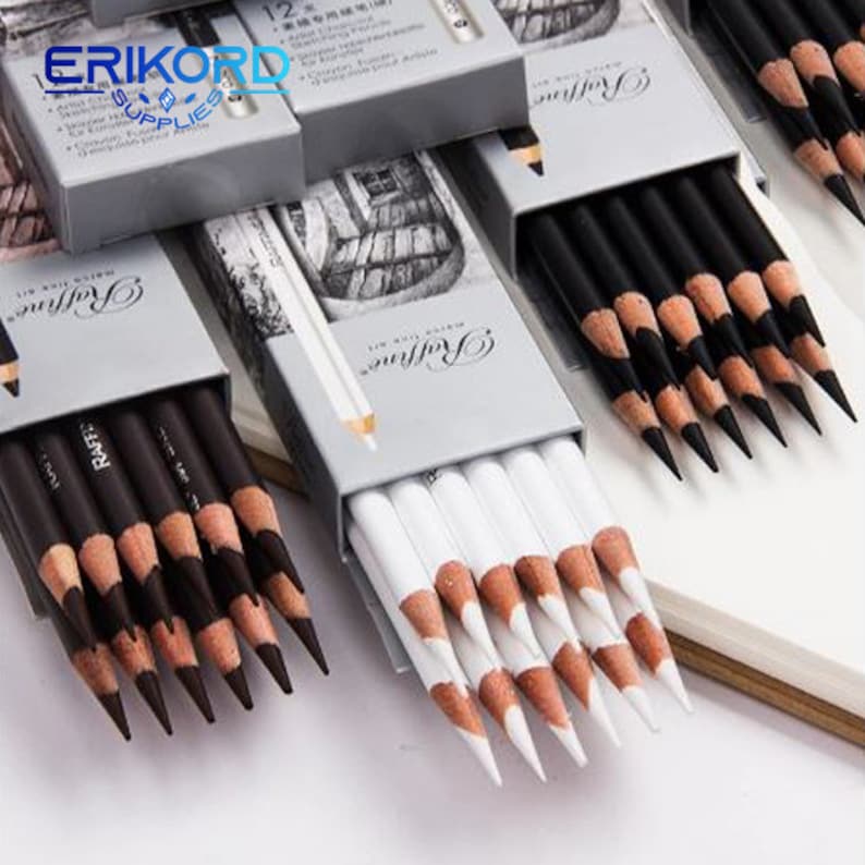 May include: Two sets of drawing pencils in their boxes. One set is black and the other is white. The boxes are labeled "Watercolor Pencils" and "Raffine".