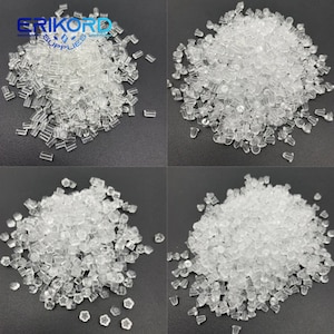 May include: A close-up view of four piles of clear plastic earring backs. The earring backs are in different shapes, including round, star, and rectangular. The earring backs are all small and translucent.