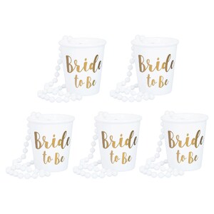 May include: Six white plastic cups with gold lettering that reads "Bride to Be" and white beaded necklaces.