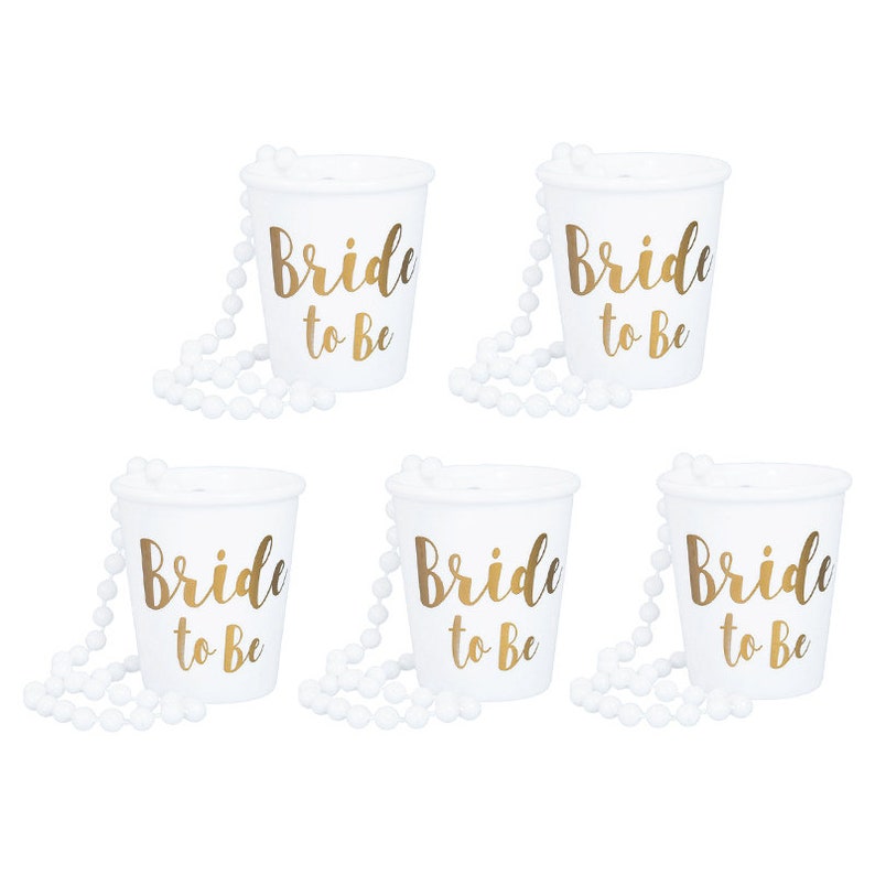 May include: Six white plastic cups with gold lettering that reads "Bride to Be" and white beaded necklaces.