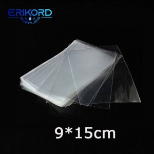 May include: A stack of clear plastic bags, 9 by 15 centimetres, for packaging small items.