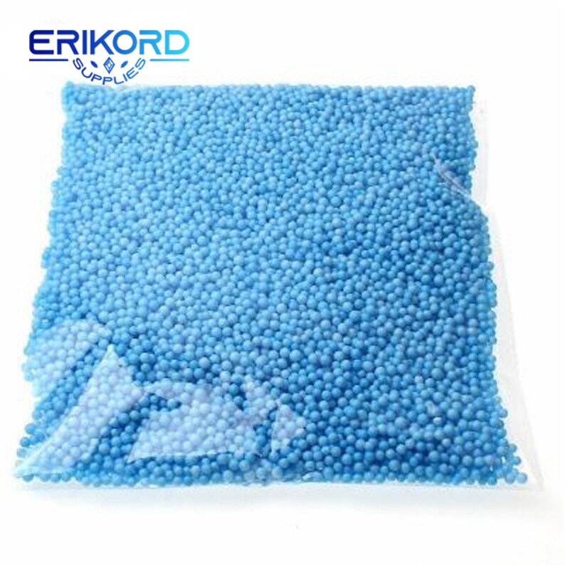 May include: A clear plastic bag filled with light blue polystyrene packing peanuts.