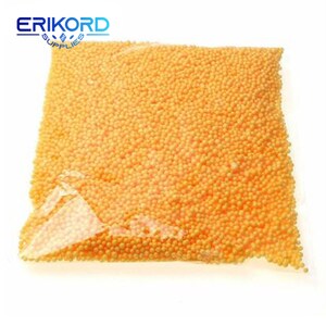May include: A clear plastic bag filled with small, bright orange foam balls. The bag is sealed and the foam balls are tightly packed together.
