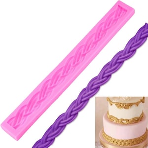 May include: Pink silicone mold for baking a braided cake decoration. The mold is shown next to a purple braided cake decoration.