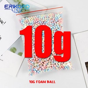 May include: A clear plastic bag filled with 10 grams of colourful foam balls. The balls are pastel pink, blue, yellow, and white. The bag has a red zipper closure. The text "10g FOAM BALL" is printed below the bag.