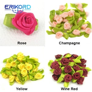 May include: Assortment of small, handmade fabric rose embellishments in four colors: rose, champagne, yellow, and wine red. Each rose is attached to a green leaf.