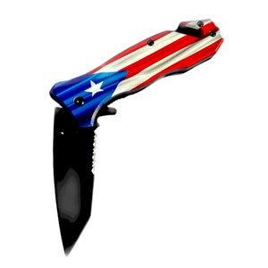 May include: A black folding knife with a red, white, and blue Puerto Rican flag design on the handle.