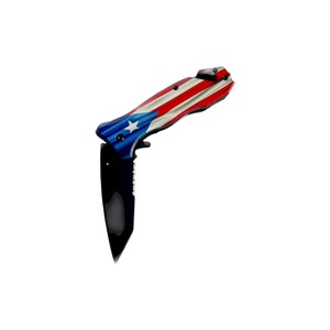 May include: A folding pocket knife with a black handle and a stainless steel blade. The handle is decorated with the flag of Puerto Rico, featuring red, white, and blue stripes with a white star.