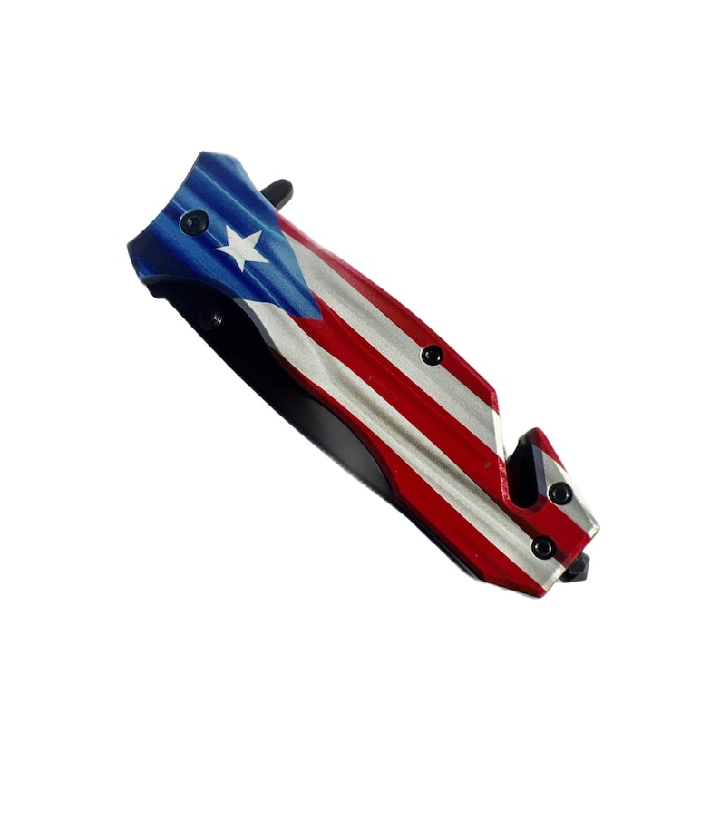 May include: A red, white, and blue pocket knife with a Puerto Rican flag design on the handle.