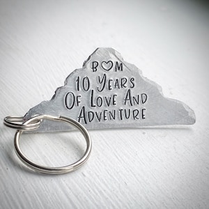 10 Years Of Love & Adventure. Wedding Anniversary aluminium Hand stamped traditional 10th gift keychain key ring. Personalised Gift